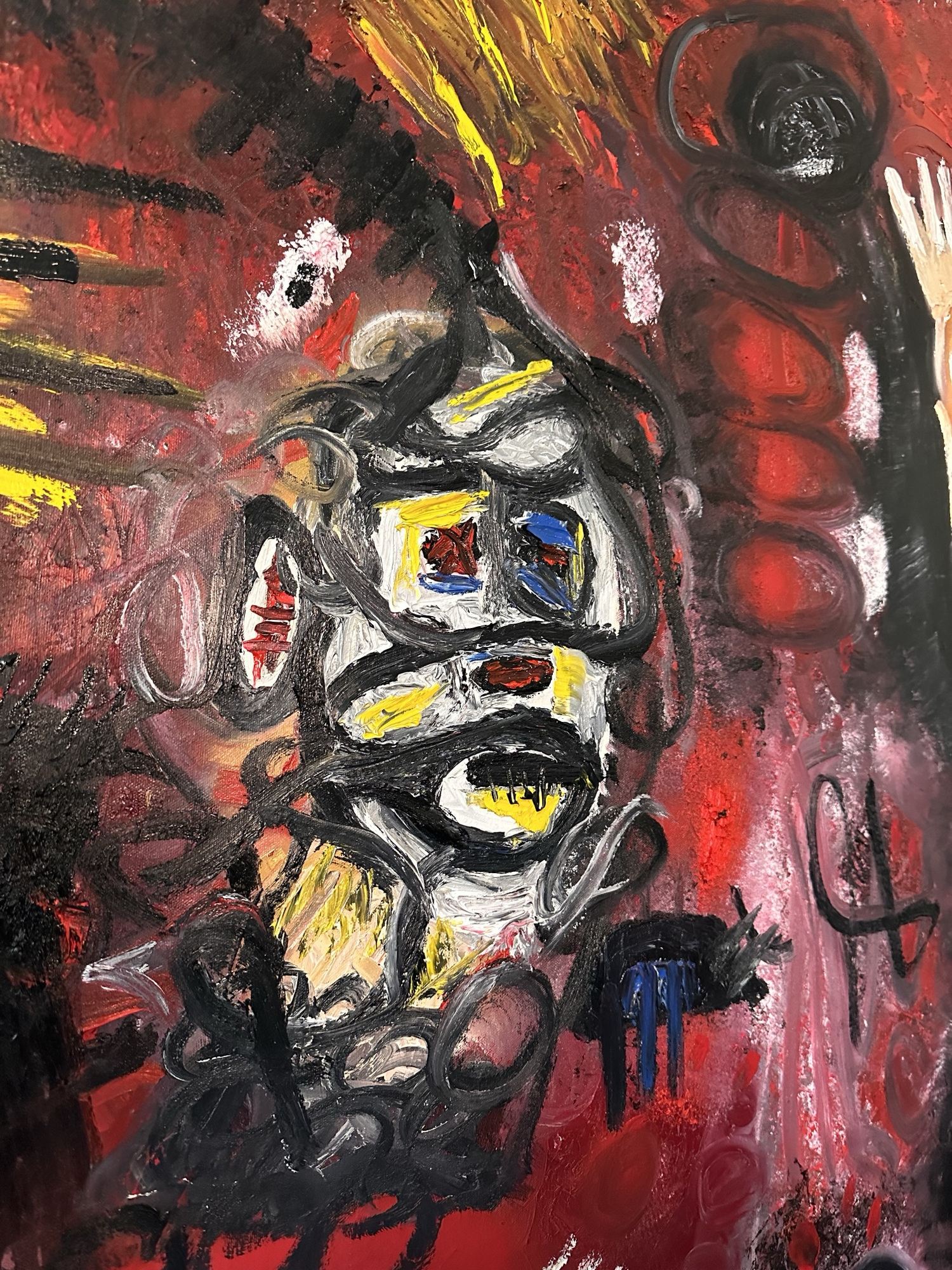 Detail: a masked face of white, grey and black loops with yellow and blue squares for eyes and a toothed mouth, among red ovals and thick black strokes
