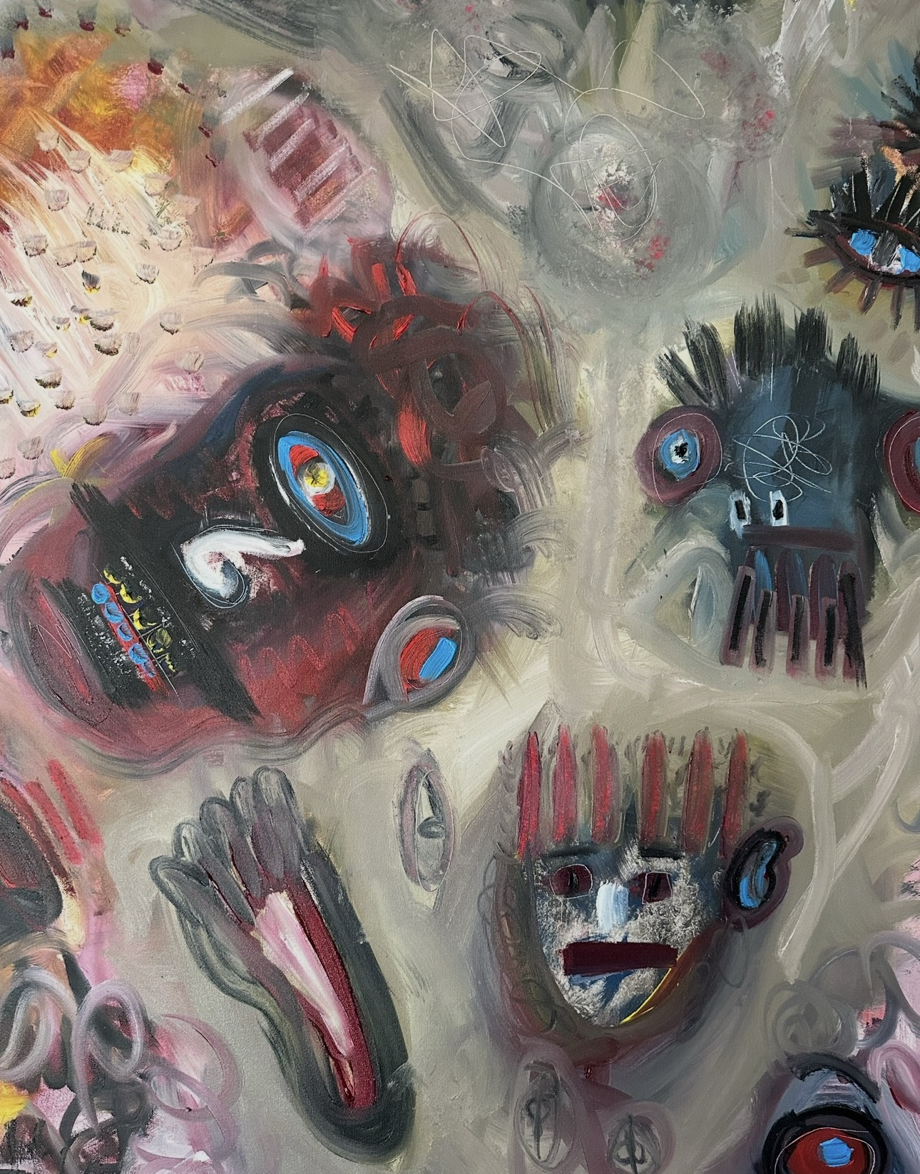 Detail: a dark red face with a blue-ringed eye, a blue-grey masked face with spiky hair and a pale striped mask, among soft grey strokes