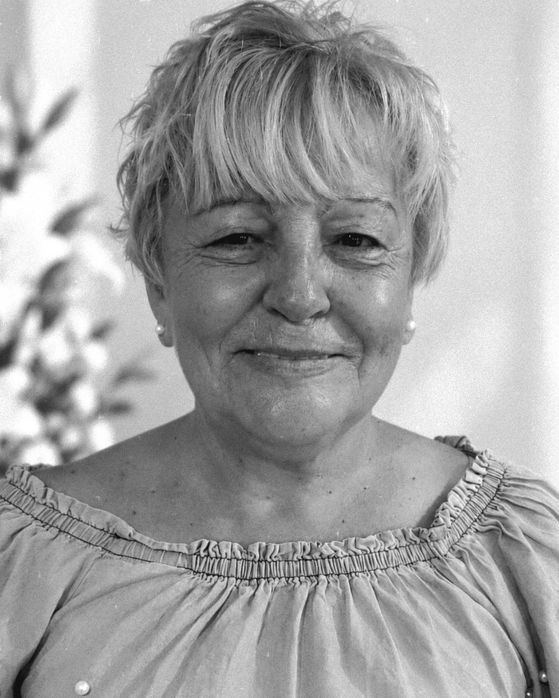 Black-and-white portrait of Consuelo Rodríguez, the artist's mother, smiling