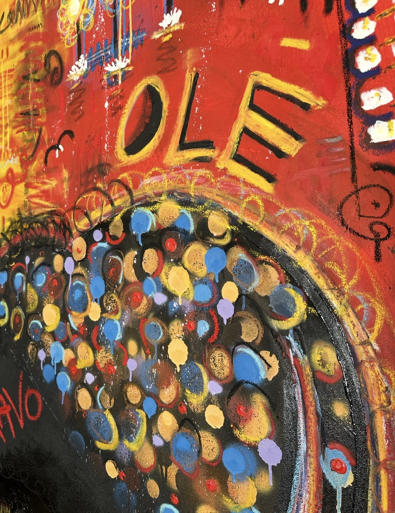 Detail: the bull's flank of blue, ochre and lilac dots with drips, beneath the word OLE in yellow and black on red