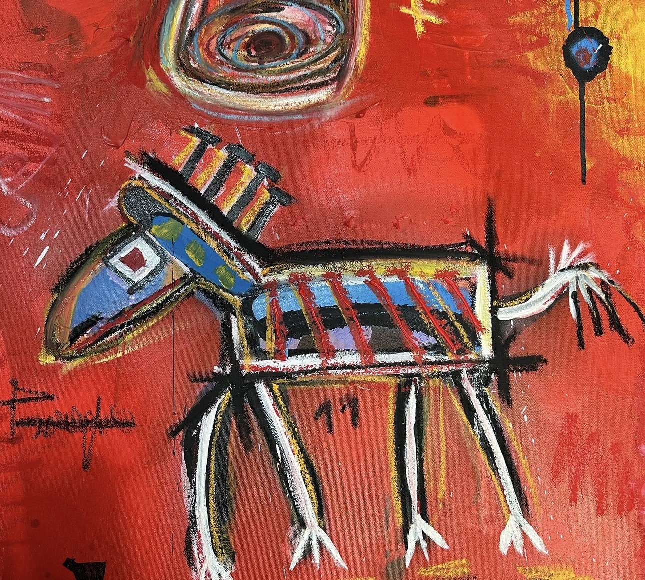 Detail: a small striped donkey with a blue head, drawn in thick black and white lines on a red ground